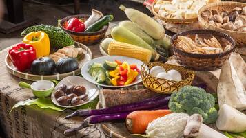 A variety of fresh vegetables and fruits displayed on a table.