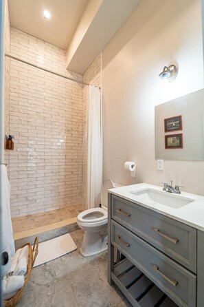 Hair dryer, towels, soap, toilet paper