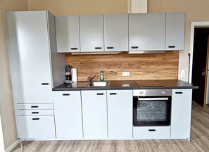 Fogão, cooktop, lava-louças, toalhas de papel