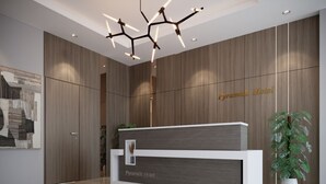 A reception desk at Pyramids Hotel with a modern design, a wooden wall backdrop, and a potted plant to the right. -  Aziz Egypt Pyramids View (Giza)