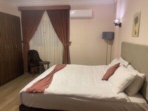 Deluxe Double Room, 1 King Bed, City View | In-room safe, laptop workspace, soundproofing, iron/ironing board -  Aziz Egypt Pyramids View (Giza)