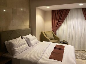 Deluxe Double Room, 1 King Bed, City View | In-room safe, laptop workspace, soundproofing, iron/ironing board