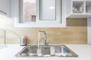 Apartamento conforto, sacada, vista para a cidade | Cozinha privada