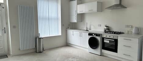 Microwave, oven, toaster, dining tables