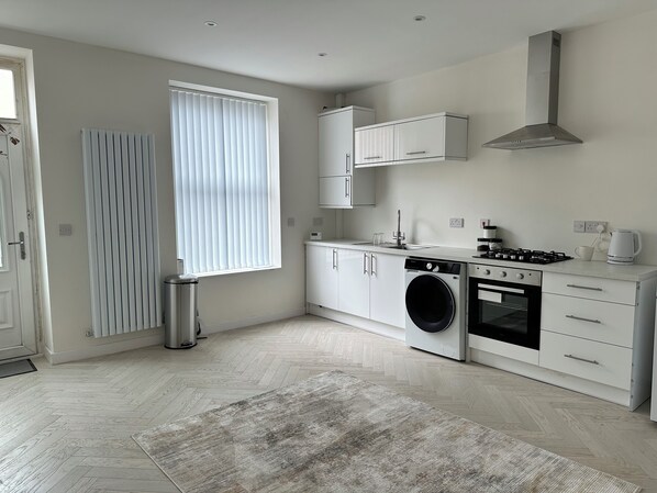 Microwave, oven, toaster, dining tables