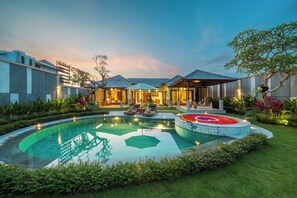 A modern resort with a swimming pool, outdoor seating, and a well-maintained garden. - Pranaya Parama Ubud Villa by Nagisa Bali (Ubud)