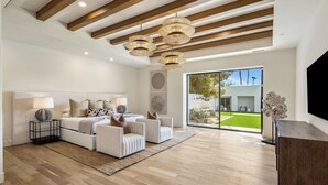A modern living room with a sofa set, a coffee table, and a TV stand. - SWSS Premier 10BR Estate | Pool with Swim‑Up Bar | Golf Simulator | Sport Court | Sauna & Cold Pl... (Scottsdale)