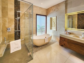 Separate tub and shower, slippers, towels, soap