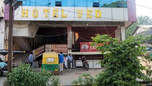 A hotel named "HOTEL VED" with a modern facade, a visible entrance, and a Raj Darbar restaurant sign below. - Hotel Ved & Restaurant  (Agra)