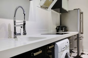 Fridge, microwave, stovetop, coffee/tea maker