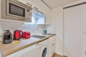 Fridge, microwave, stovetop, coffee/tea maker