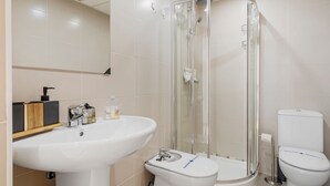 A modern bathroom with a glass-enclosed shower, a pedestal sink, and a toilet. - Cozy Getaway With Pool in Riviera del Sol - Ref 99 (Mijas)