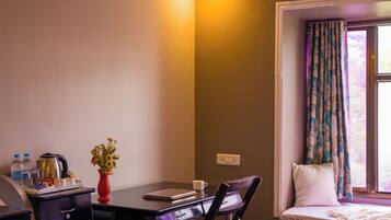 Premium bedding, desk, laptop workspace, iron/ironing board