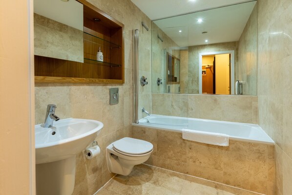 A modern bathroom with a sink, toilet, and bathtub. - The Close in Newcastle Upon Tyne (Newcastle-upon-Tyne)