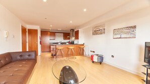 A modern apartment with a living room, kitchen, and dining area. - The Peak in Newcastle Upon Tyne (Newcastle-upon-Tyne)