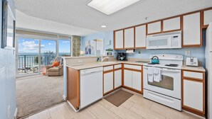 A modern kitchen with a microwave, stove, and sink. - *Fall into Savings-20% Off New Bookings thru 2026* (Myrtle Beach)