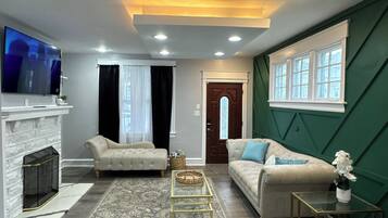 Smart TV, fireplace, table football, books