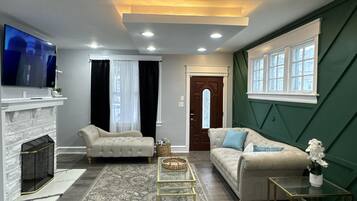 Smart TV, fireplace, foosball, books