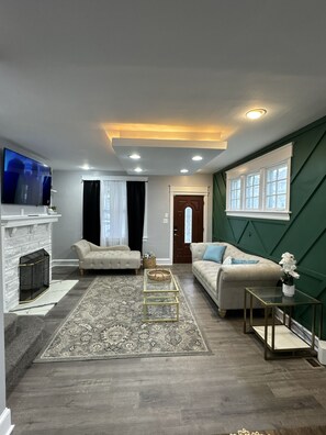 Smart TV, fireplace, table football, books