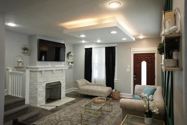 Smart TV, fireplace, foosball, books