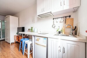 Standard Apartment | Private kitchen | Fridge, microwave, rice cooker, cookware/dishes/utensils