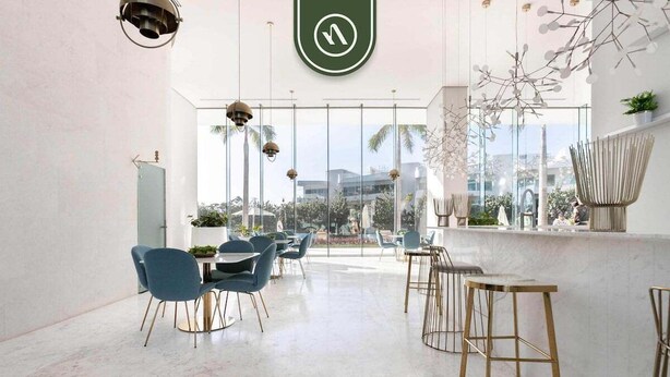 A modern dining area with a high ceiling, large windows, and a view of palm trees. - New 2BR APT - Beach Access - Pool - GYM - Jacuzzi (Nuevo Vallarta)