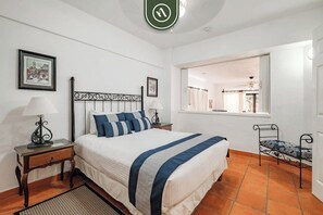 1 bedroom, desk, iron/ironing board, travel crib