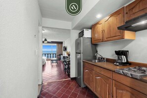 Fridge, microwave, stovetop, coffee/tea maker