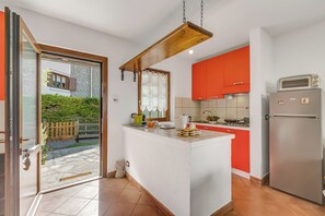 Family House, 1 Bedroom (La Casa Di Dadà) | Private kitchen | Fridge, oven, stovetop, coffee/tea maker
