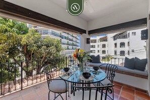 Outdoor dining - Stylish 2 BR Condo in Romantic Zone - Rooftop Pool (Puerto Vallarta)