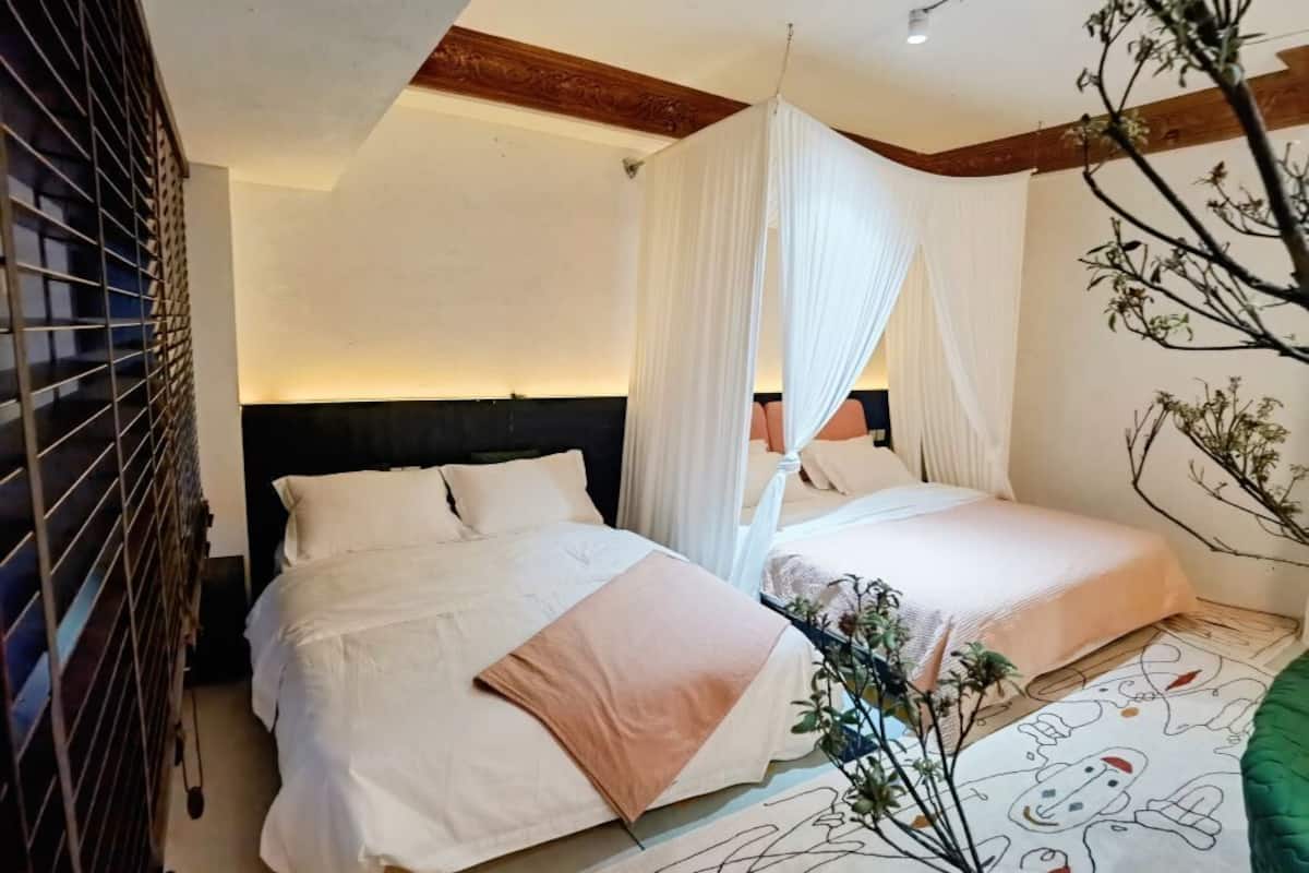 Family Room, City View | Pillowtop beds, desk, laptop workspace, blackout drapes
