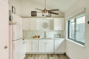 Fridge, stovetop, dishwasher, coffee/tea maker
