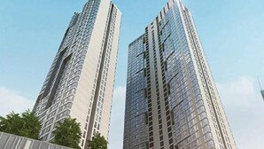A modern high-rise building with a prominent 'R' logo, surrounded by lush greenery and a shopping area. - The Robertson Residences Free Gym & Pool (Kuala Lumpur)