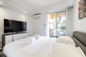 1 bedroom, desk, iron/ironing board, travel crib