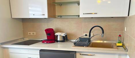 Fridge, microwave, stovetop, coffee/tea maker