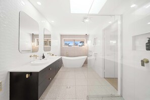 Shower, hair dryer, towels, shampoo
