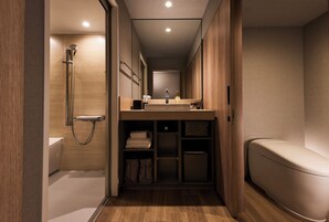 Separate tub and shower, free toiletries, hair dryer, slippers