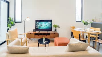 Superior Apartment, 2 Bedrooms, Balcony, City View | Living area | 35-inch TV with cable channels, offices