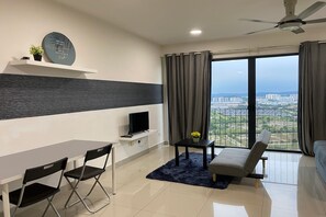 Superior Studio, 1 Queen Bed, Balcony, City View | Living area | 35-inch TV with cable channels