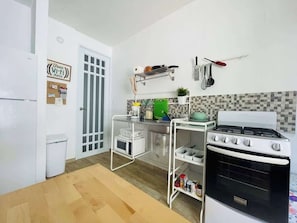 Fridge, microwave, stovetop, coffee/tea maker