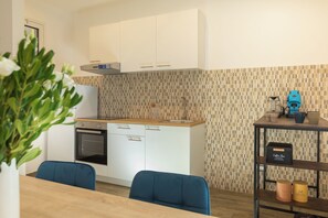 Deluxe Duplex, Balcony, City View | Private kitchen | Fridge, stovetop, espresso maker, coffee/tea maker