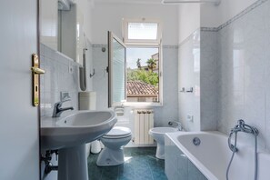 Classic Condo | Bathroom | Separate bathtub and shower, towels, soap, shampoo