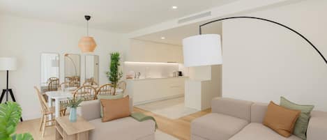 A modern living room with a sofa set, a dining table with chairs, and a kitchen area in the background.