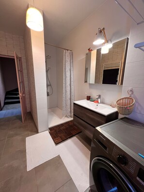 Shower, towels, soap, toilet paper