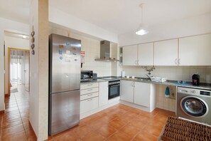 Fridge, microwave, cookware/dishes/utensils