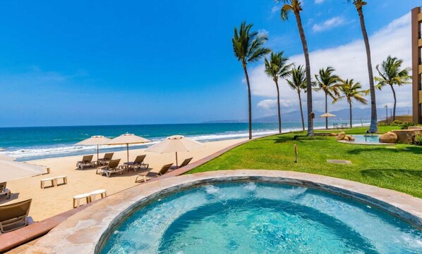 On the beach, sun-loungers, beach towels