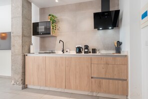 Fridge, microwave, stovetop, coffee/tea maker