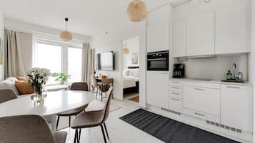 Superior Condo, 1 King Bed with Sofa bed | Living area | 55-inch flat-screen TV with cable channels, heated floors