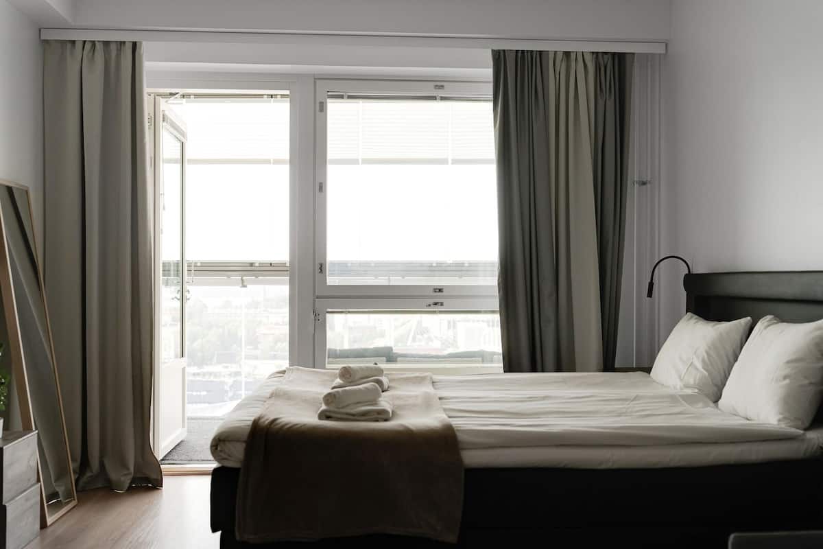 Superior Triple Room, Balcony, City View | Desk, laptop workspace, blackout drapes, soundproofing