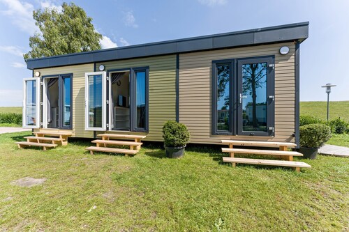 Tiny Home 'Surfbrett Am Deich' mit Gemeinschaftsgarten und WLAN